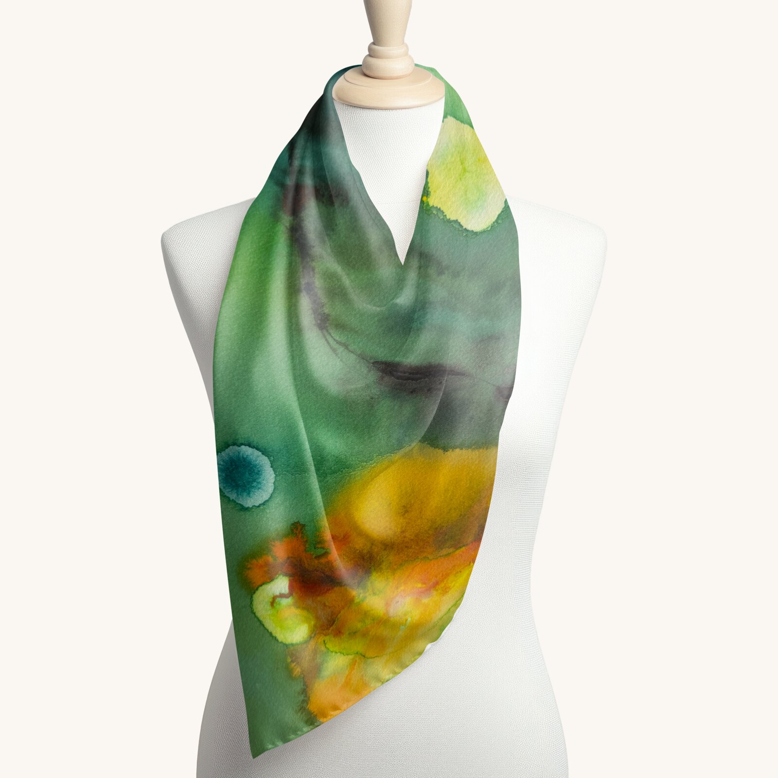 Green and gold watercolor printed on a silk scarf
